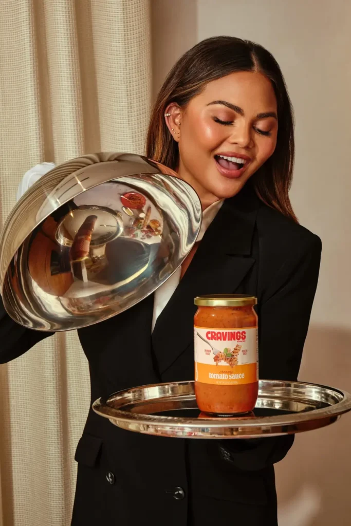Chrissy Teigen with cookware from her brand Cravings