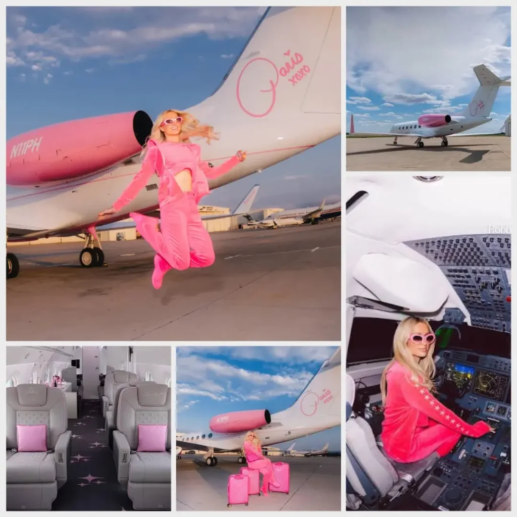 Paris Hilton in a pink outfit posing on the steps of her private jet