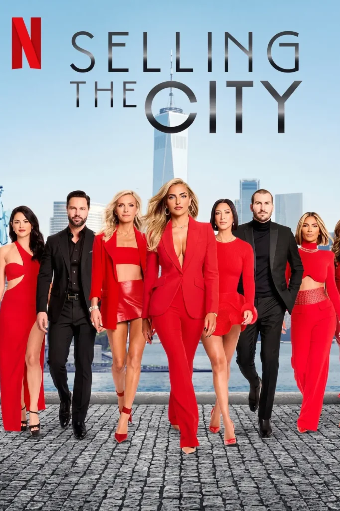 Selling the City cast posing in red and black outfits in front of the Manhattan skyline
