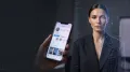 Conceptual image of a fictional digital model beside a smartphone and AI verification graphics.